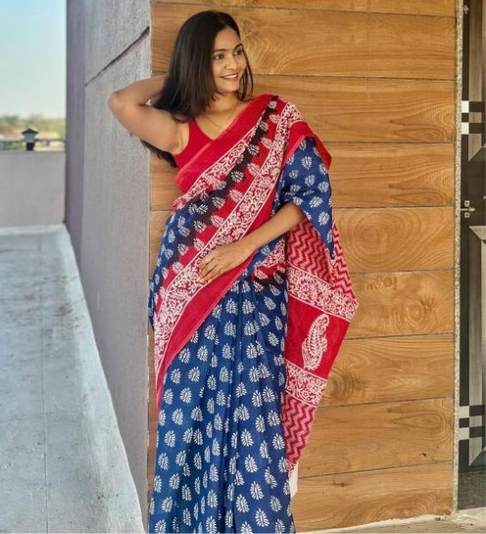 PID-68022-Women-s-Linen-Floral-Printed-Saree-With-Unstitched-Blouse-5-5-Mtr-Blue-Red-1.jpg Women's Linen Printed Saree With Unstitched Blouse - 5.5 Mtr (Blue-Red) - Image 1