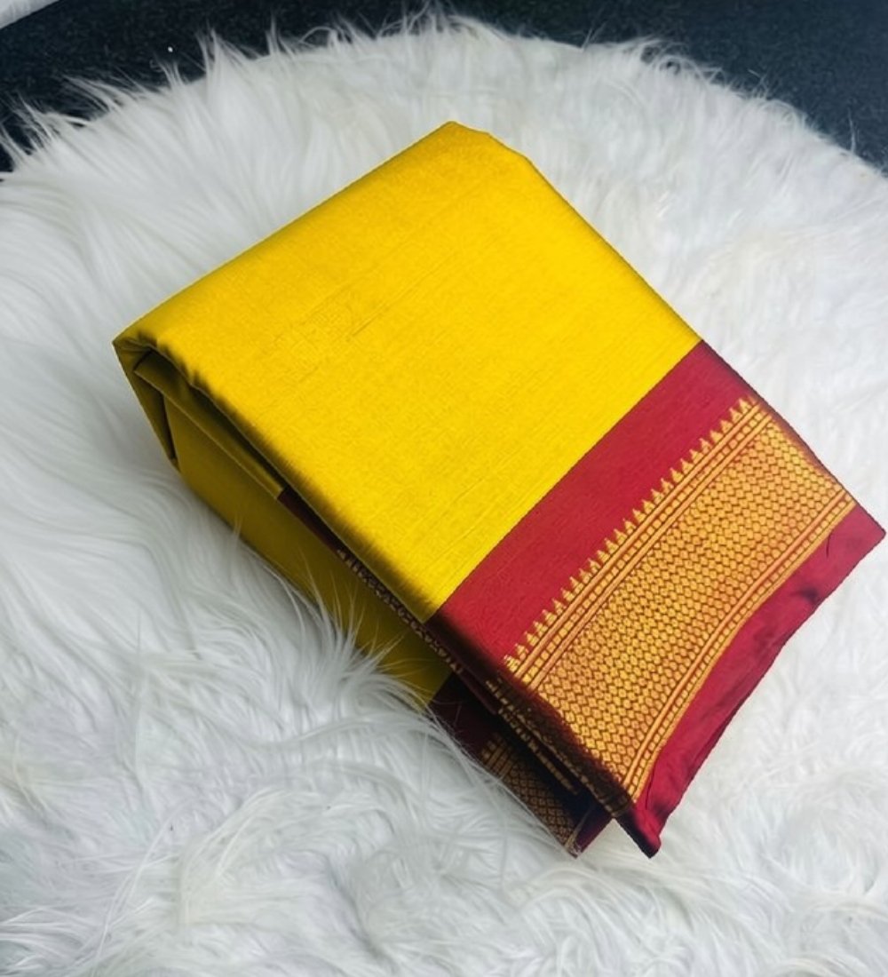 PID-68051-Women-s-Cotton-Silk-Striped-Saree-With-Unstitched-Blouse-5-5-Mtr-Gold-1.jpg Women's Cotton Silk Solid Saree With Unstitched Blouse - 5.5 Mtr (Yellow-Red) - Image 1
