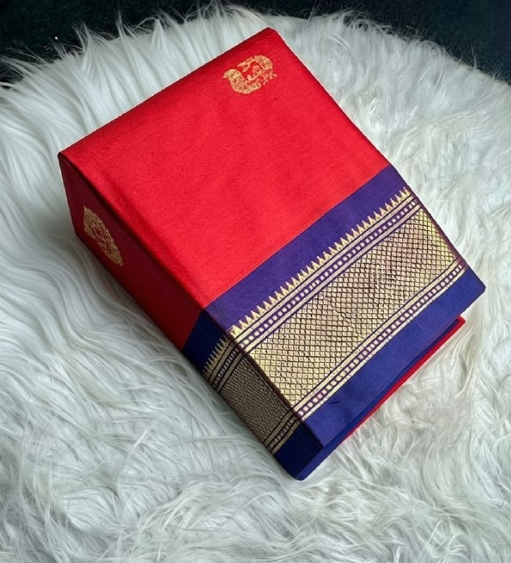 PID-68066-Women-s-Cotton-Silk-Striped-Saree-With-Unstitched-Blouse-5-5-Mtr-Red-1.jpg Women's Cotton Silk Solid Saree With Unstitched Blouse - 5.5 Mtr (Red-Blue) - Image 1